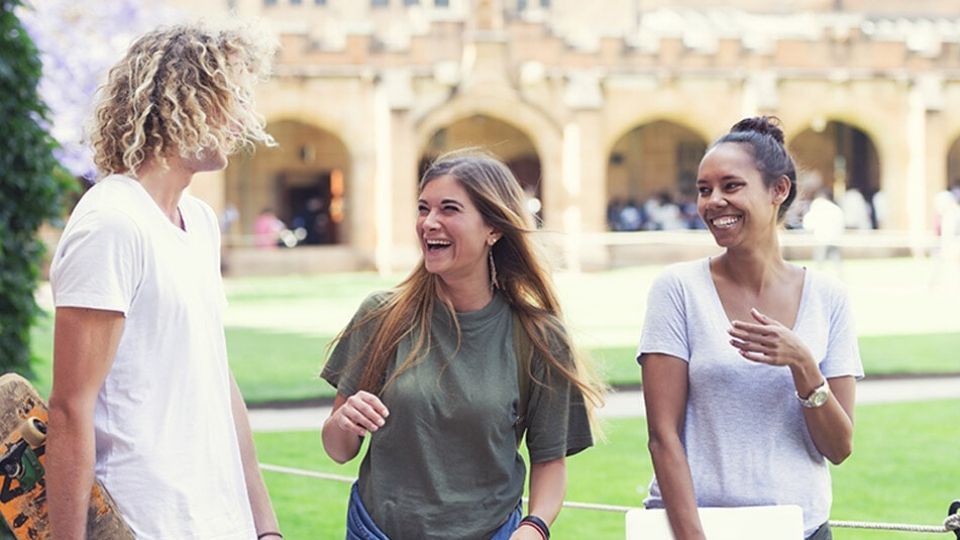 Three young international students discussing how they chose their Australian university