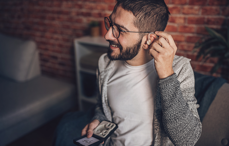 Man putting on headphones