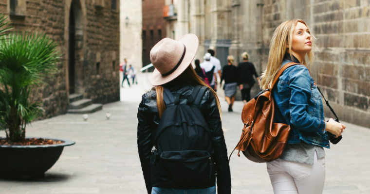 Two woman walking through a European street