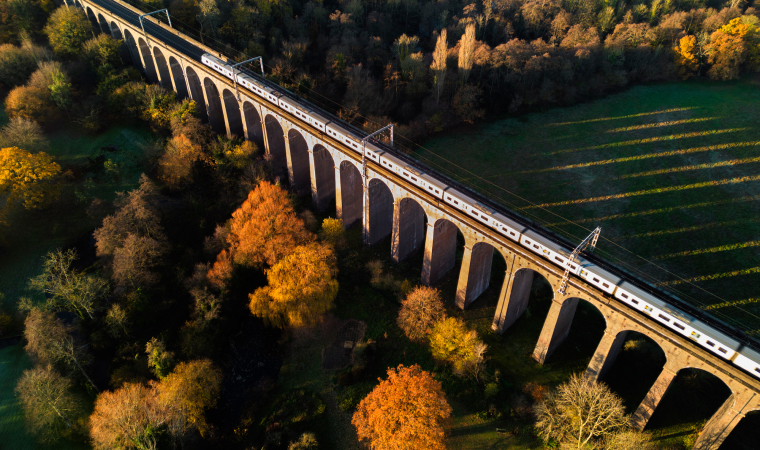A train going over a bridge in the UK