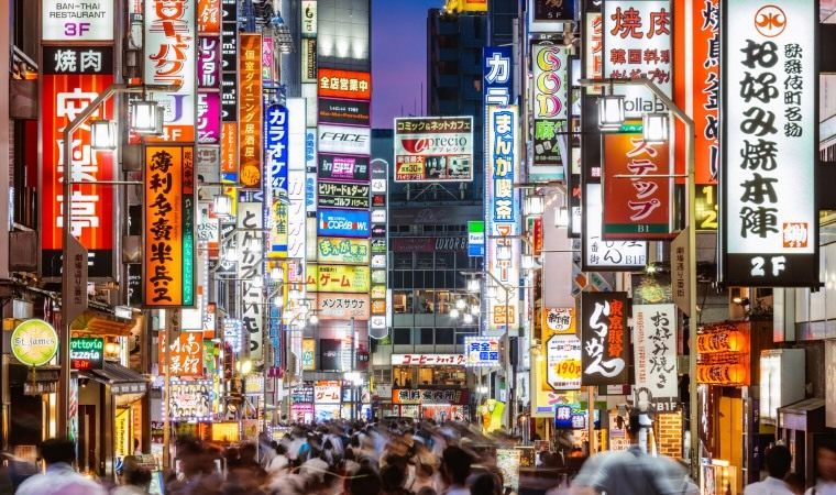 A busy street in Japan at night