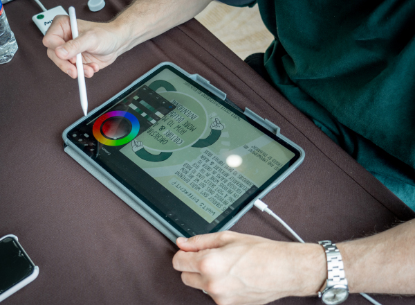 Close up shot of a designer interacting with a tablet