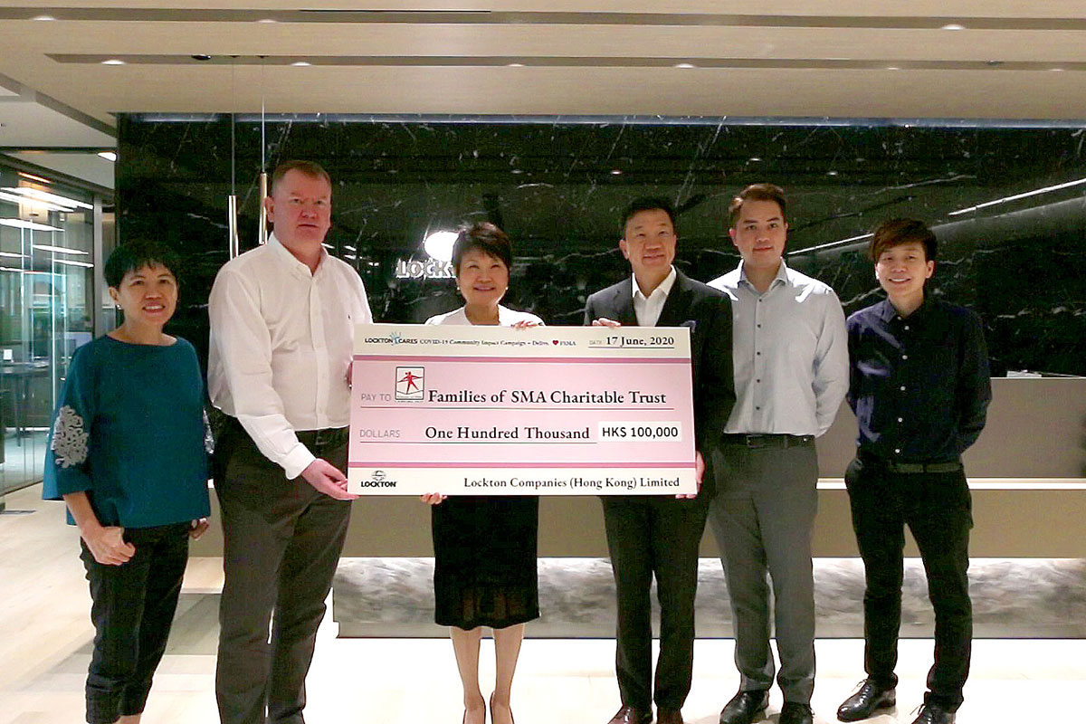 CSR team of Lockton Hong Kong presenting a check to charity fund of FSMA in July 2020.