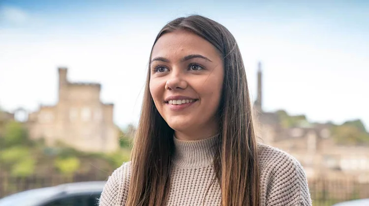 Courtney smiling outside