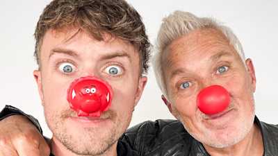 Roman and Martin Kemp wearing red noses