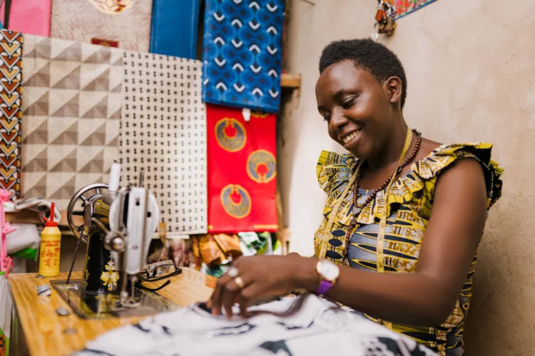 A tailor working at their sewing machine
