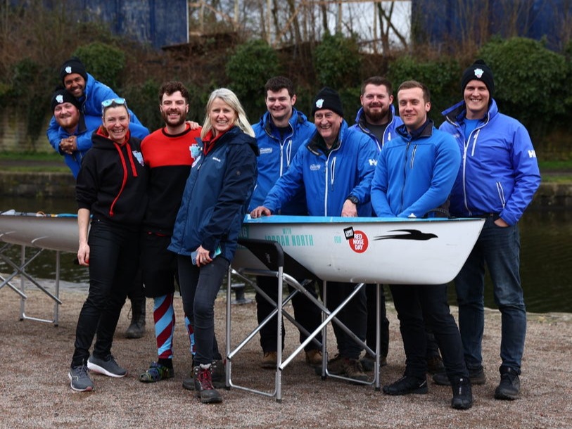 Group of people smiling for a photo.