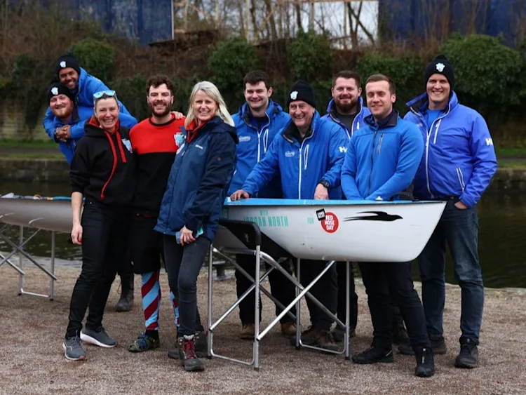 Group of people smiling for a photo.