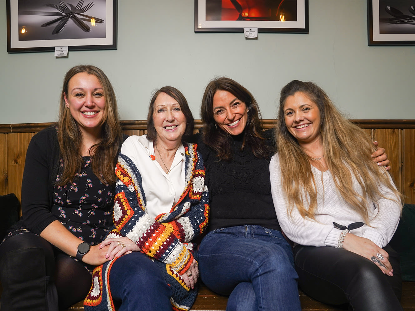 Kinship Carers Meryem, Wendy, and Kelly link arms with Kinship founder Davina.