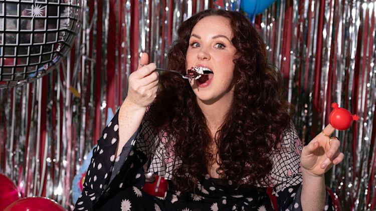 Catherine Bohart eating cake