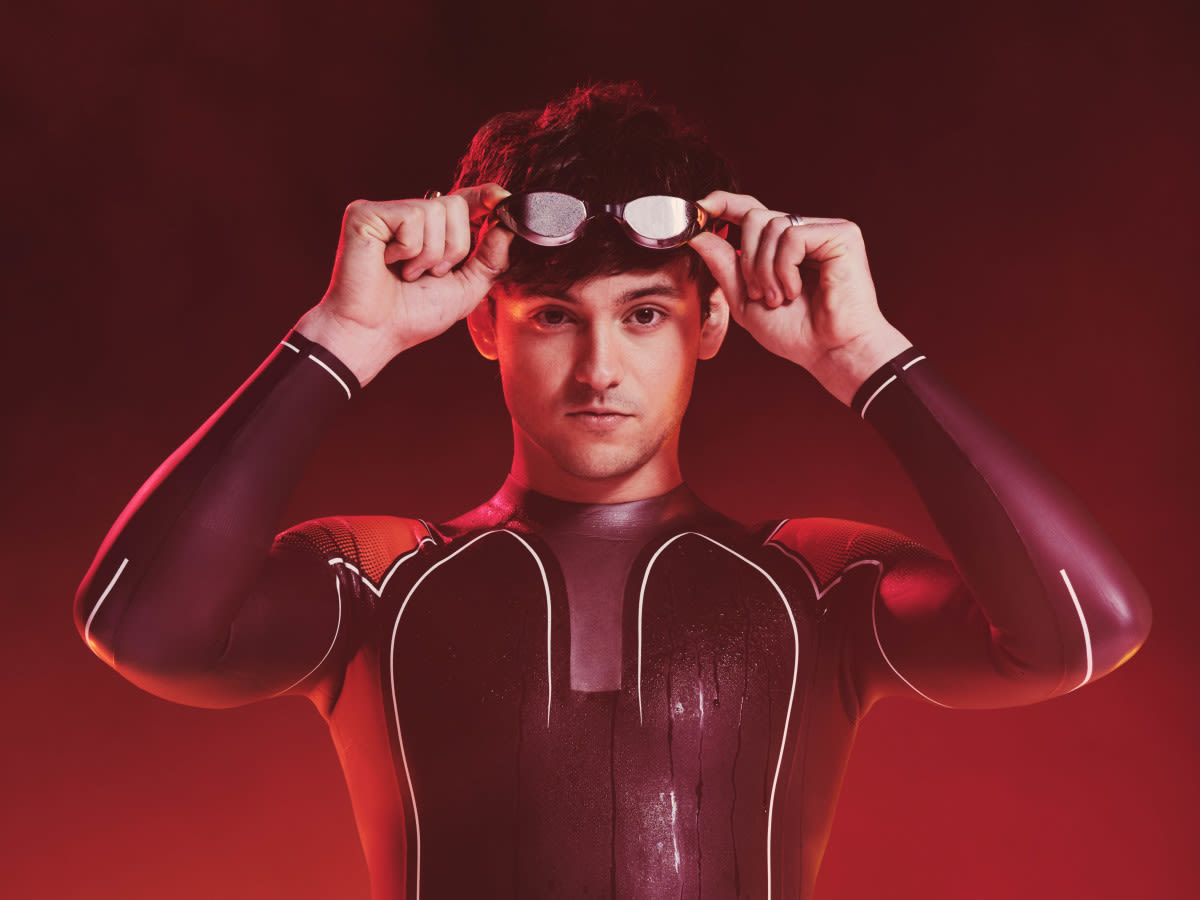 Tom Daley wearing a wet suit and swim goggles for his Hell of a Homecoming Challenge for Red Nose Day 2022.