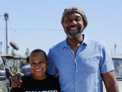 Lenny Henry poses with a woman in South Africa