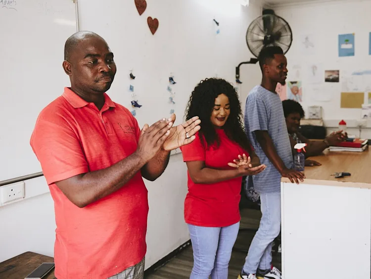 iCare workers present to a class