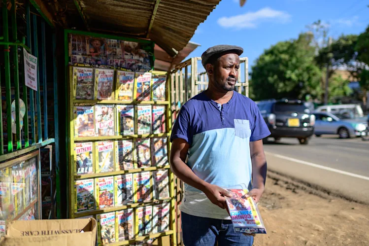 Ben standing outside of a newsstand in Nairobi