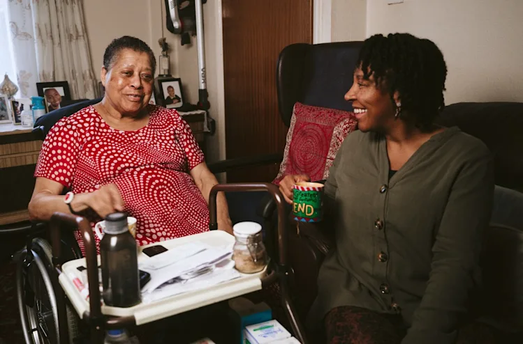 Yvonne share a cup of tea with her daughter, Natasha.