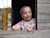  A little girl looking out of a window