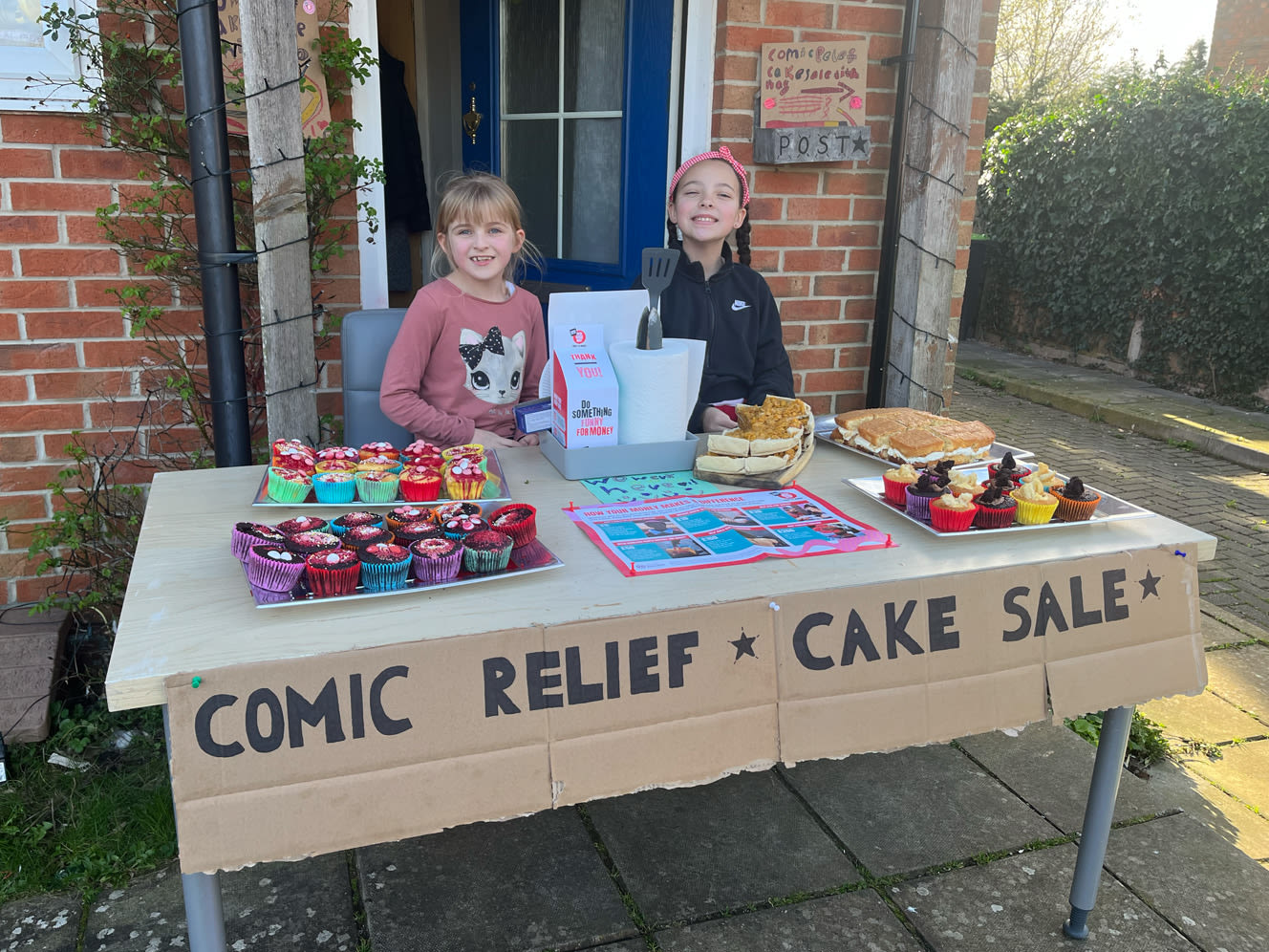 Aliyah and Jess with their cake sale display