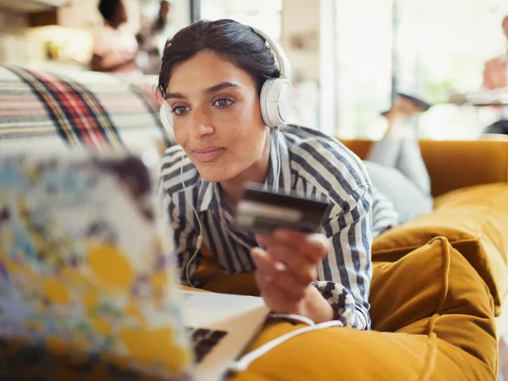 Woman paying on her laptop.