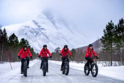 Sara Davies, Vicky Pattinson, Alex Scott and Laura Whitmore trek across an icy road on fat wheel bikes in the artic wilderness on day one of the Red Nose Day Artic challenge.