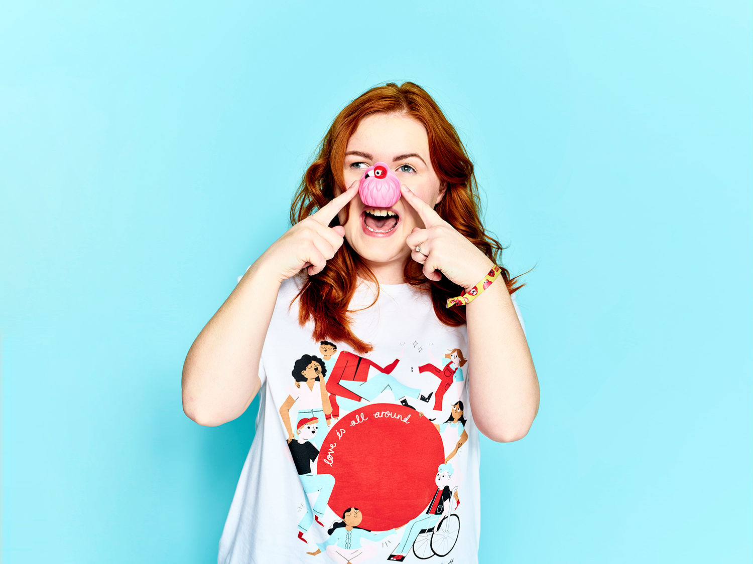 Excited person pointing to a pink nose
