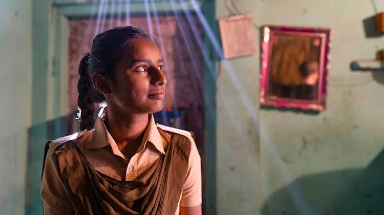 A girl looking towards the future.