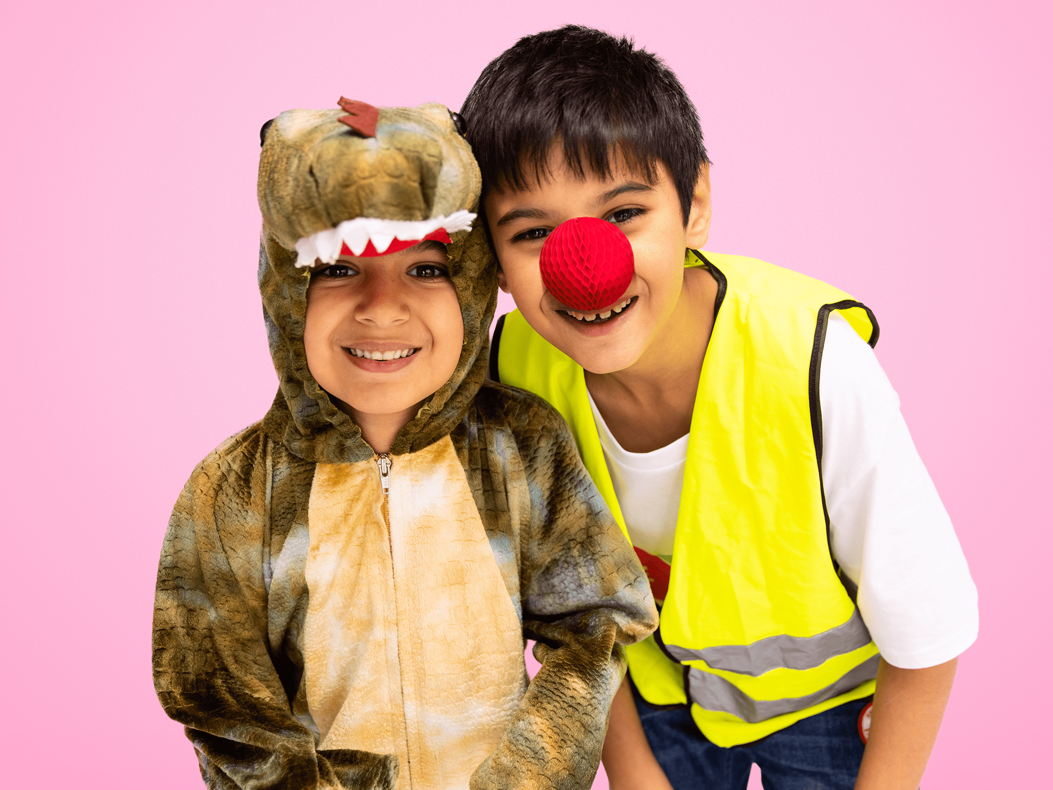 One boy in a dinosaur costume and one boy in a high vis and red nose 
