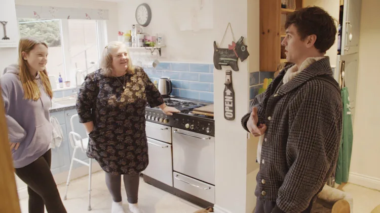 Matilda with her mum, Lena, talking with Tom Daley in their kitchen.
