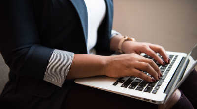 Woman typing on laptop