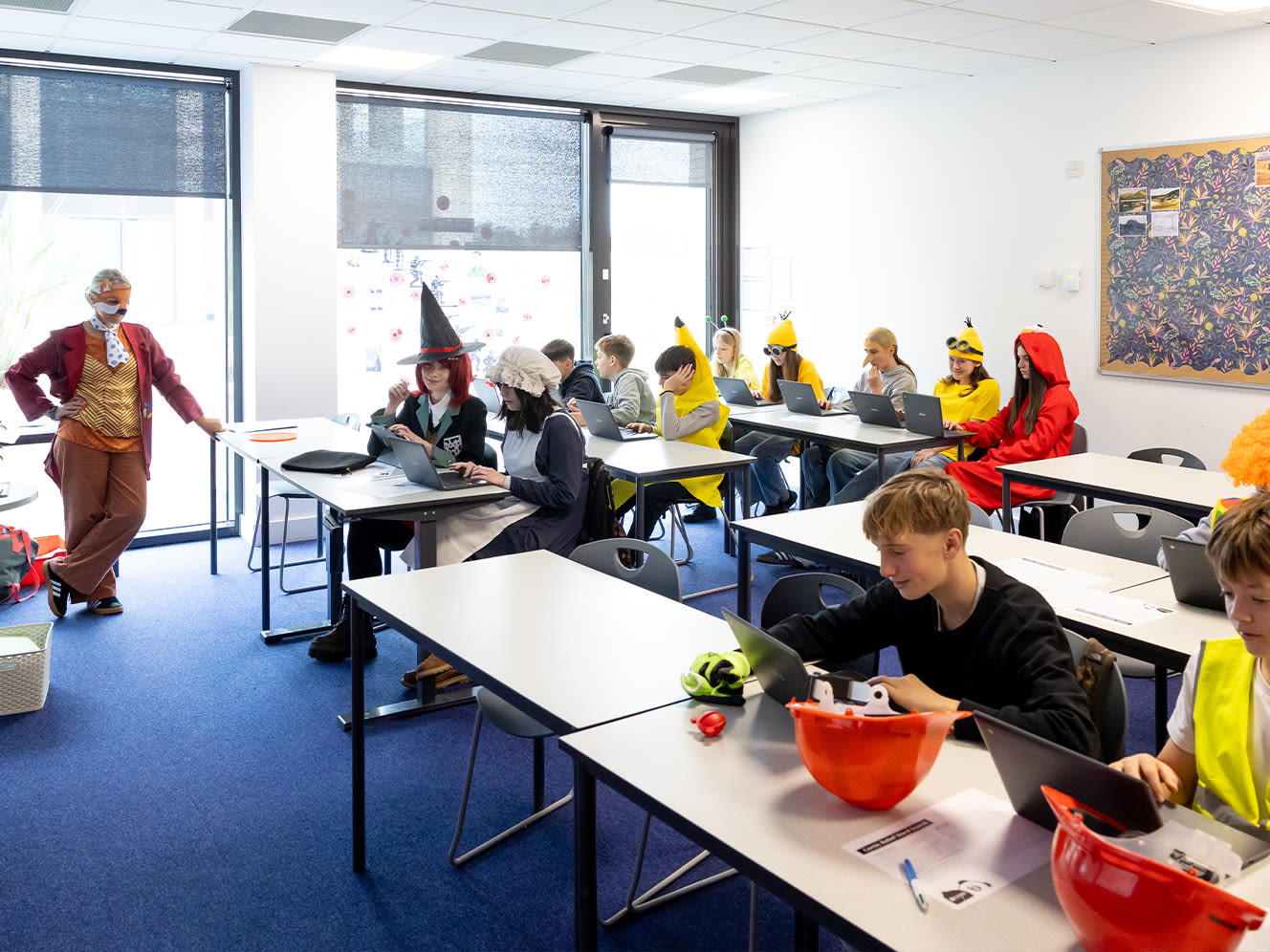 Student fundraisers sitting in a classroom