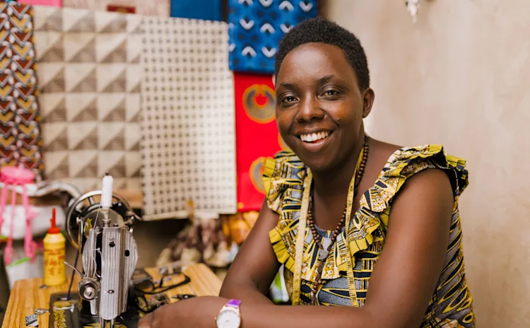 A small business owner sitting in their studio workspace
