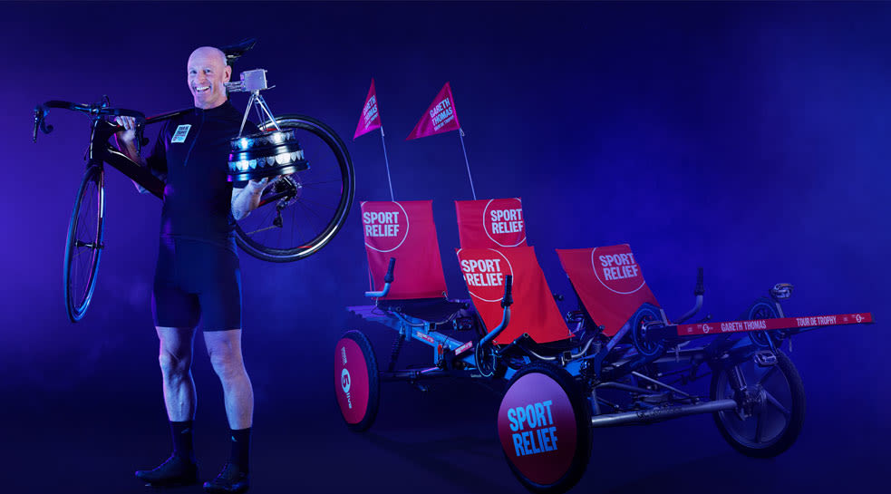 Gareth Thomas posing with two bikes