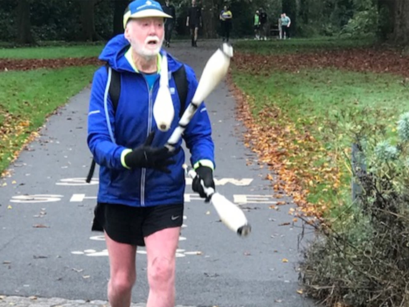 Fundraiser David Harrison running whilst juggling three clubs