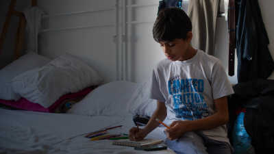 Farhad drawing on his bed