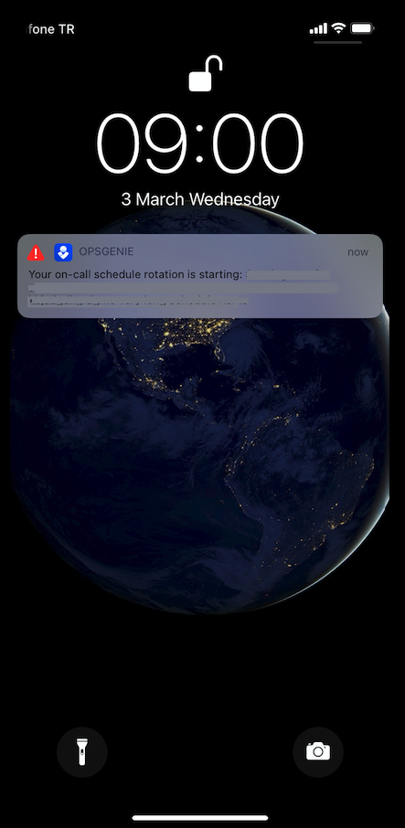 A screenshot showing a critical alert as a push notification in Opsgenie's iOS app.