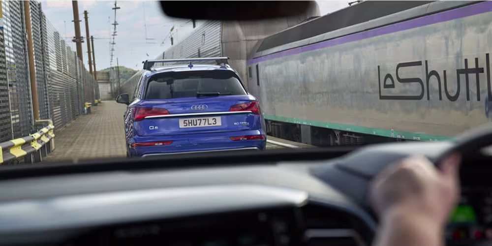 a car and a LeShuttle train