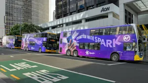 Three Spark 'It's better with Spark' campaign double decker buses on Auckland's Lower Albert Street.