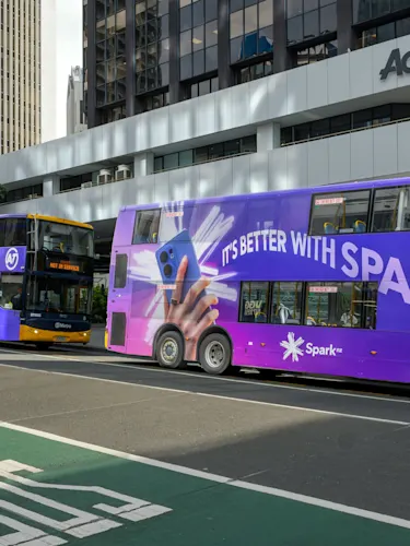 Three Spark 'It's better with Spark' campaign double decker buses on Auckland's Lower Albert Street.