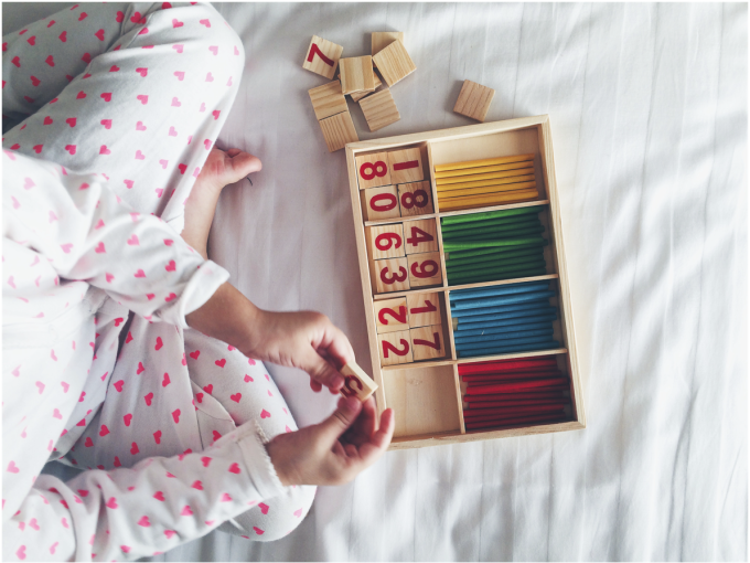 kid playing with numbers