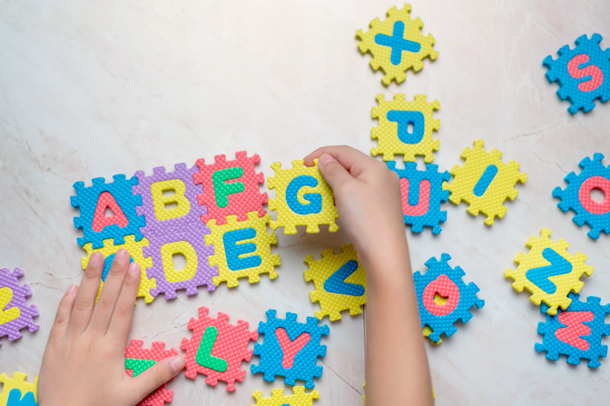 An educational wood puzzle for children, teaching the English alphabet
