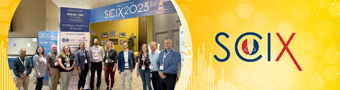 Group photo of the team at SciX 2025, with the SciX logo visible on the right.