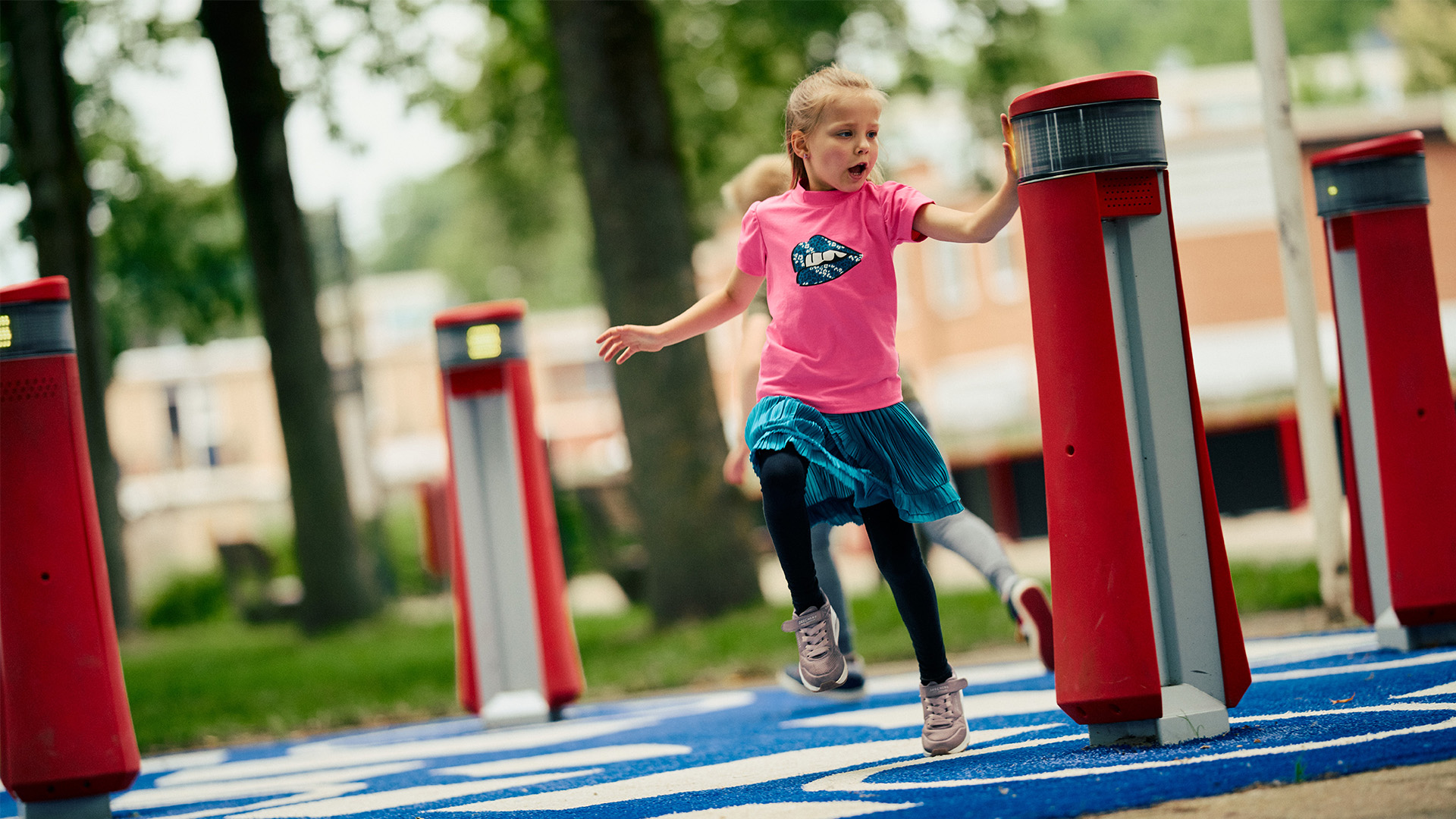 Children playing tag on the Memo