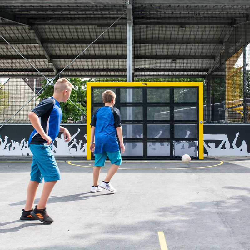 Children playing football on the Sutu Interactive ball wall 