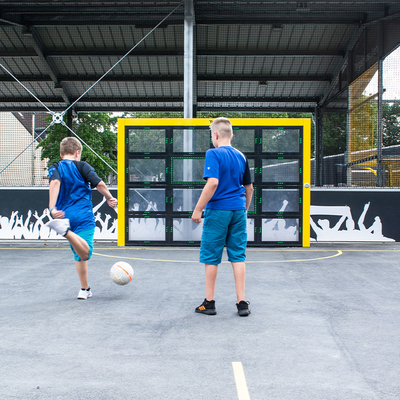 Children playing football on the Sutu Interactive ball wall 