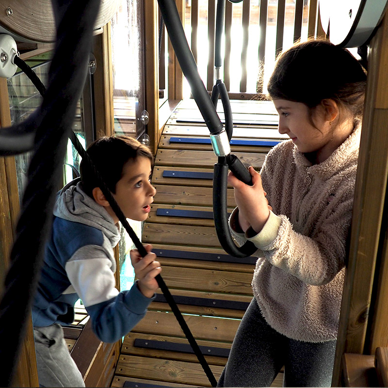 Children playing inside the Vertical Maze