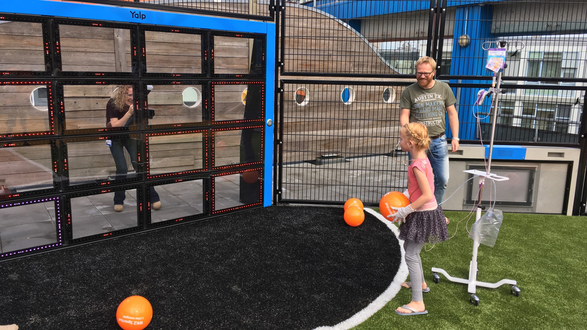 Children and adults playing on the rooftop playground at Wilhelmina Hospital in the Netherlands