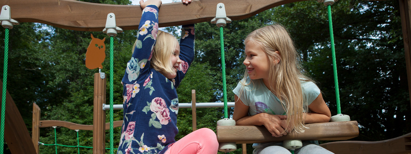 Two girls playing on the Flora