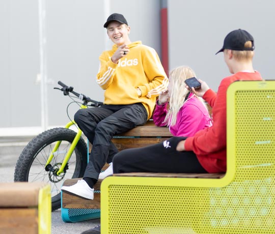 Teenagers sitting on Chillout benches