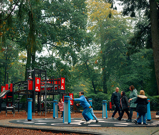 Families playing on the Lappset Memo at Randenbroek park, The Netherlands
