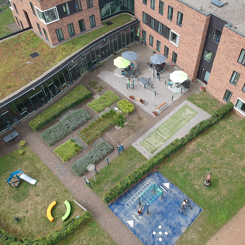 Aerial view of Norschoten Care Organization's Generation Garden with seating, garden, and exercise areas.