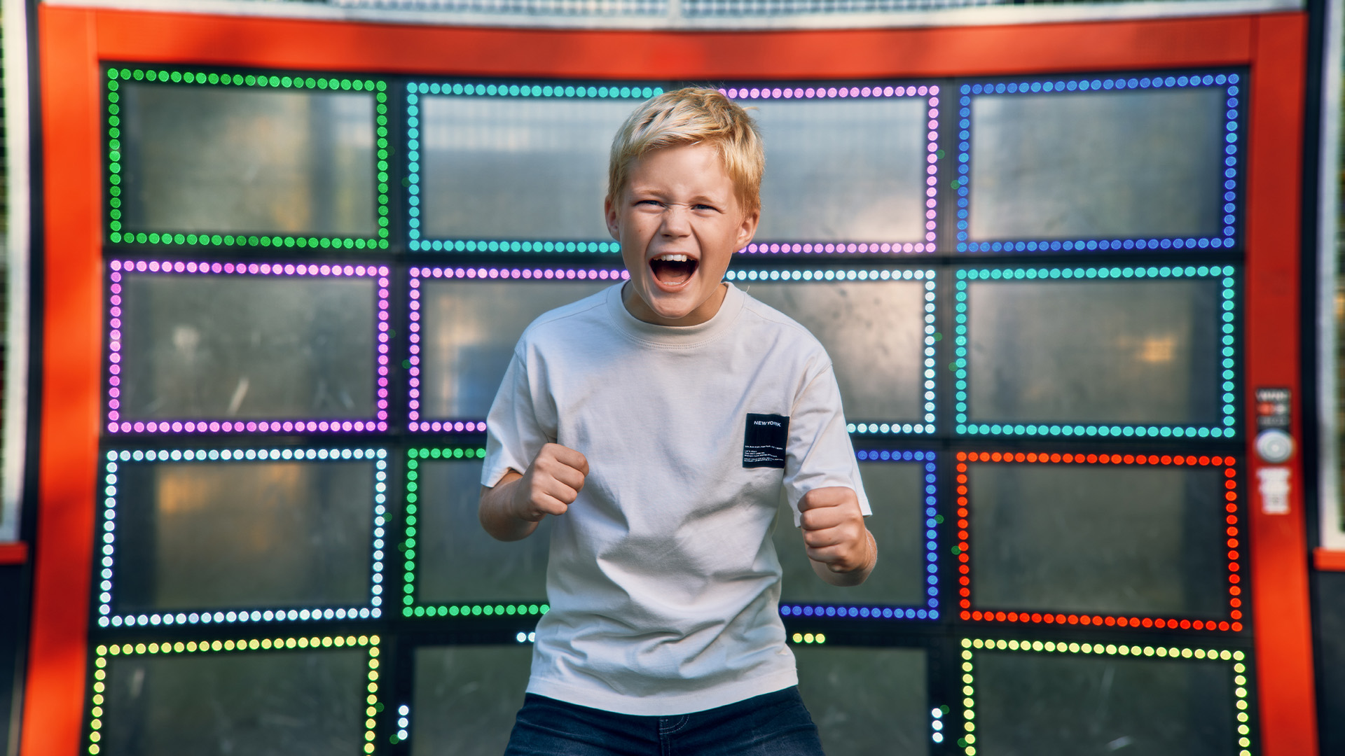 Excited child enjoys interactive playground equipment the Lappset Sutu!